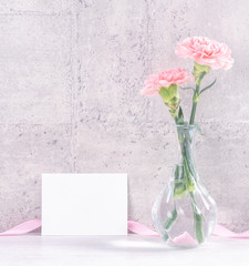 Mothers day handmade giftbox surprise wishes photography - Beautiful blooming carnations with pink ribbon box isolated on gray wallpaper design, close up, copy space, mock up
