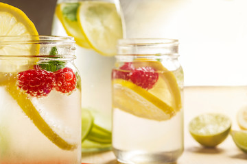 Fototapeta na wymiar Cold summer soda with lemon and berries in glass