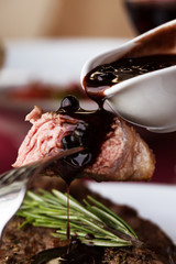 Medium rare steak with sauce macro