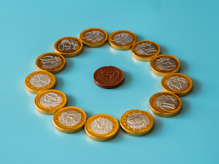Chocolate coins on celestial background