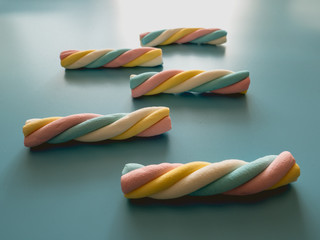 Candies with cloud shape on a blue background