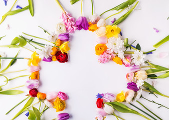 Flowers and cross Easter abstract concept on a white background. Copy space.