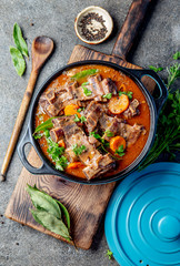 Beef ribs Bourguignon. Beef ribs stewed with carrot, onion in red wine. France dish. Top view