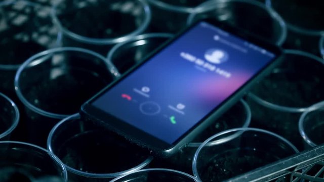 Incoming call to agronomists mobile phone in close up
