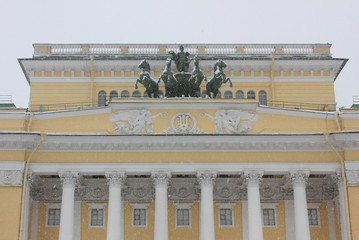 Alexandrinsky theatre facade architecture close up view in St. Petersburg, Russia. Russian State Pushkin Academy Drama theater historical building front with columns, ornaments and statues