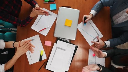 Business concept. A working team clapping their hands