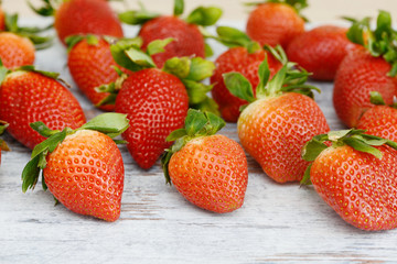 Strawberries lying on wood
