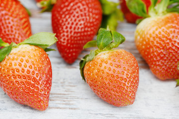 Strawberries lying on wood