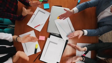 Business concept. A young working team clapping their hands