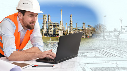 engineer at his workplace with notebook in an industrial company in mechanical engineering