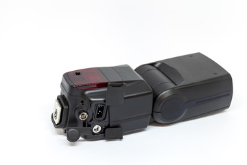 Black external flash for a camera with open additional connectors