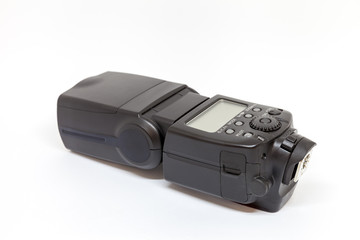 Black external flash for a camera on a white background