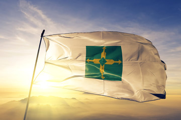 Distrito Federal state of Brazil flag waving on the top sunrise mist fog