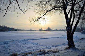 sunset over the river in winter