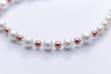 Closeup Pearl necklace on white background