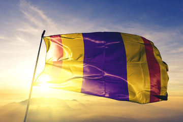 Ciales municipality of Puerto Rico flag waving on the top sunrise mist fog