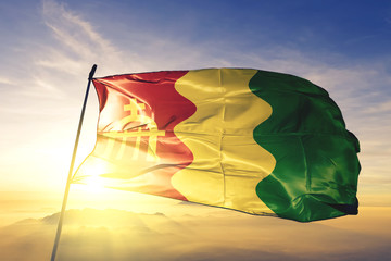 Loiza municipality of Puerto Rico flag waving on the top sunrise mist fog