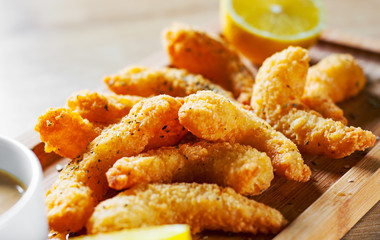 Fried Shrimp with sauce and lemon on wooden table background