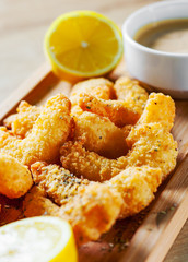 Fried Shrimp with sauce and lemon on wooden table background