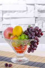 Glass fruit bowl with fruit