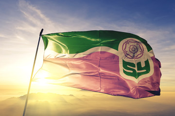 South Yorkshire county of England flag waving on the top sunrise mist fog