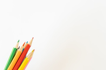 Fototapeta premium Bunch of colored children's pencils for drawing on a white background