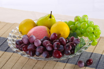 Glass fruit bowl with fruit