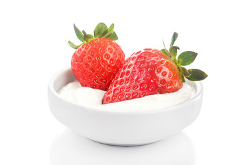 Fresh red strawberry in bowl with tasty sour cream