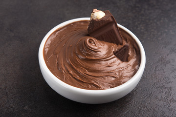 Sweet chocolate cream with bars and nuts