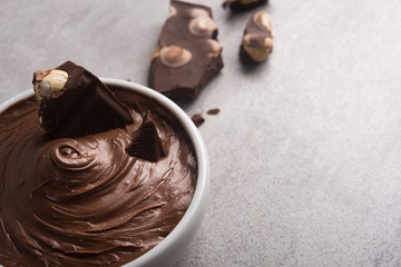 Sweet chocolate cream with bars and nuts
