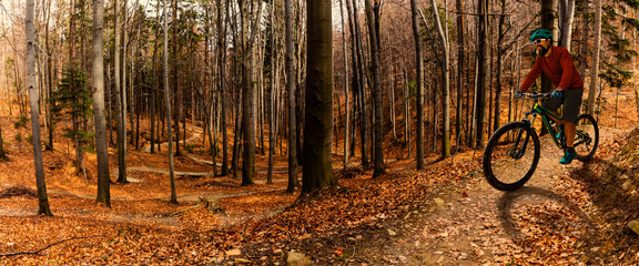 Cycling man riding on bike at sunset mountains forest landscape. Cycling MTB enduro flow trail track. Outdoor sport activity.