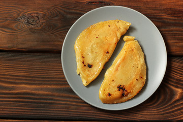 Chebureks on a wooden background. Food