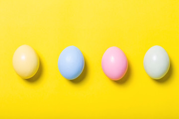colorful easter eggs on yellow  background