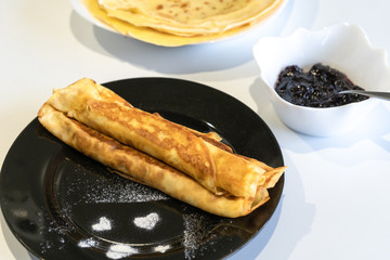 Pancakes and jam on the white table