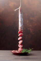 Dry-cured sausage with rosemary.