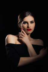 Beautiful model girl with red lips . Red manicure on nails .Beauty and esthetic care