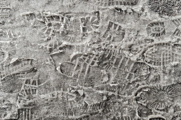 Footprints in the snow in the spring. Footprints in the snow. Snowbreak, thaw. Spring. Snow...