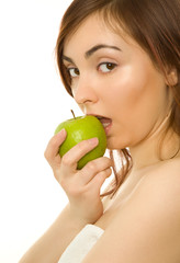 Beautiful woman with green apple isolated on white