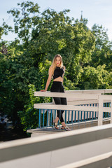 young woman sitting on a bench in the park