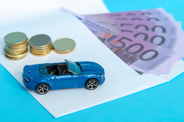 envelope and cash and toy car