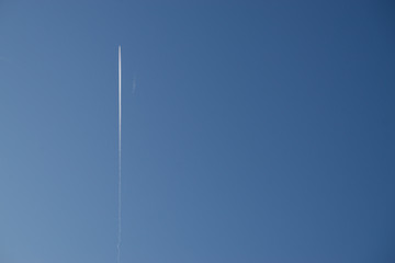 Aeroplane vapor trails in jet stream from jet aircraft.