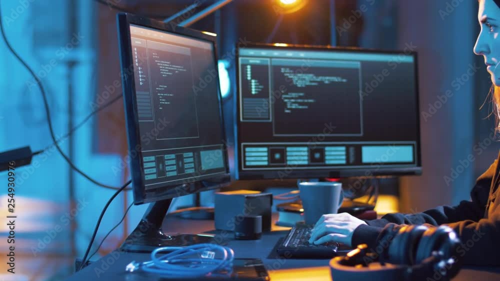 Poster cybercrime, hacking and technology concept - female hacker in dark room creating code or using compu