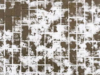tile walkway covered with snow in winter.