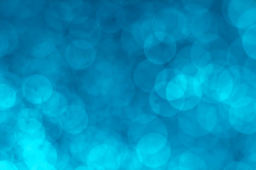 blue color abstract bokeh glitter light background. defocused circle sparkle effect glamour magic decoration for background and wallpaper template.