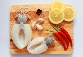 seafood,fresh octopus or squids raw on wooden board