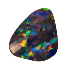 Natural blue shimmering opal macro on white background