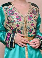Moroccan caftan in blue. Dressed by the Moroccan bride on her wedding day. Moroccan caftan is one of the most famous traditional clothing in the world