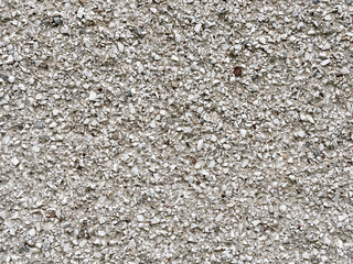 decorative plaster with stone sprinkling. background texture