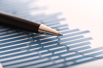 close up. ballpoint pens and business data on the Des