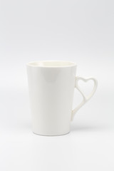 A white creamy cup with heart symbol handle